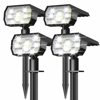 Set of four solar-powered garden spotlights with LED bulbs.